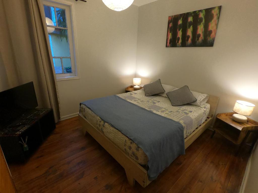 Postel nebo postele na pokoji v ubytování Escarabajo Hostel