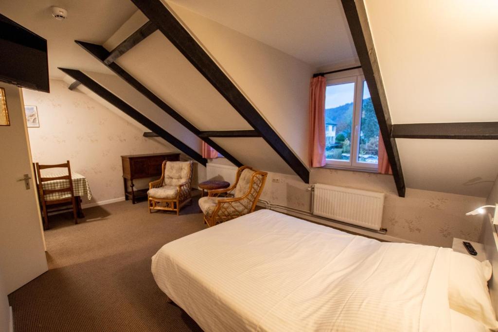 Postel nebo postele na pokoji v ubytování Auberge Le Vieux Moulin