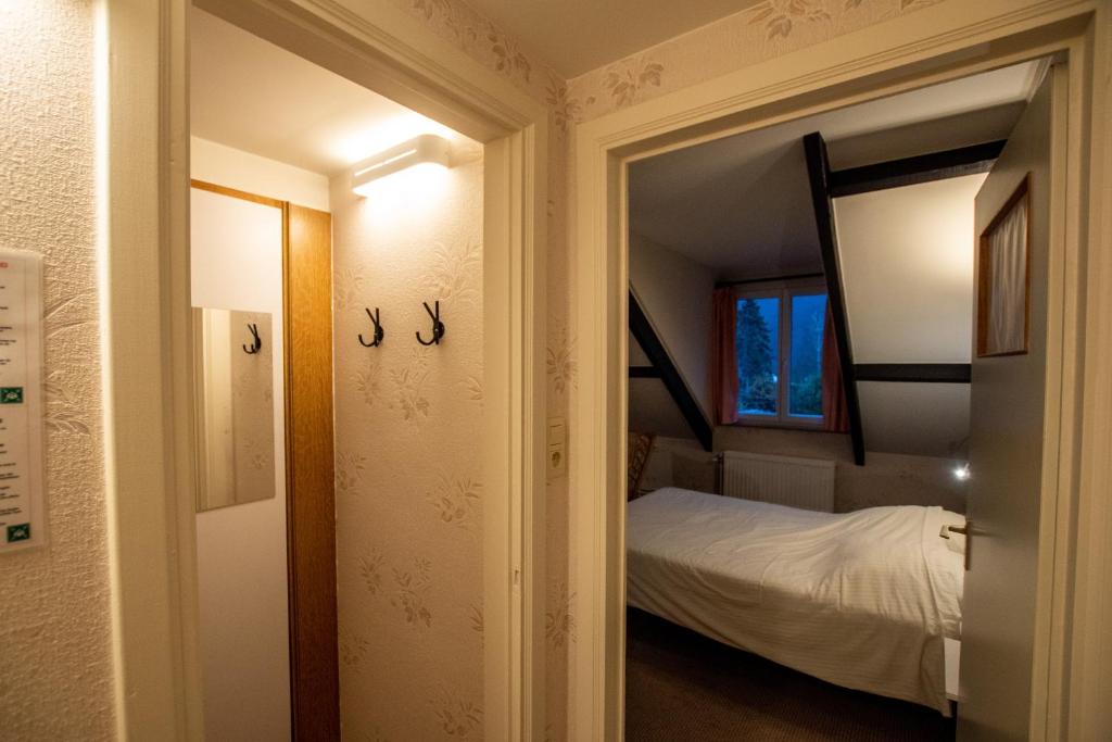 Postel nebo postele na pokoji v ubytování Auberge Le Vieux Moulin