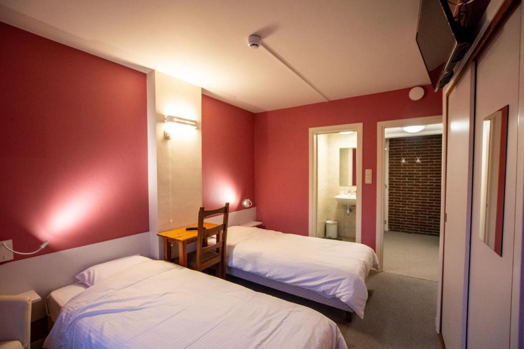 Postel nebo postele na pokoji v ubytování Auberge Le Vieux Moulin