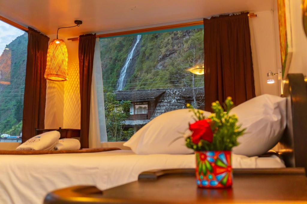 Postel nebo postele na pokoji v ubytování Hotel De Mi Pueblo