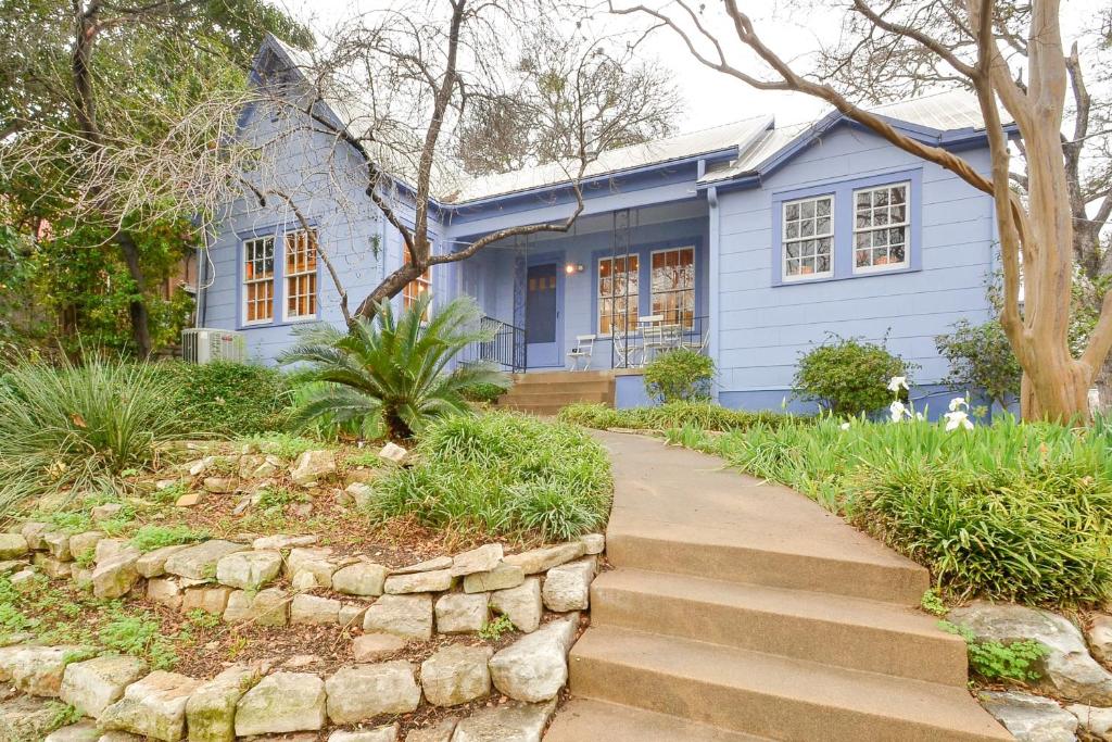 a blue house with a stone path in front of it at Moroccan-Inspired in Austin