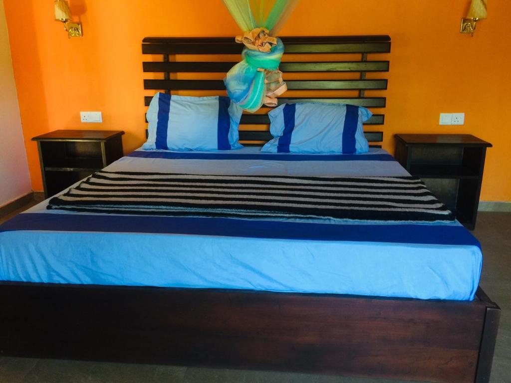 Postel nebo postele na pokoji v ubytování orchid villa