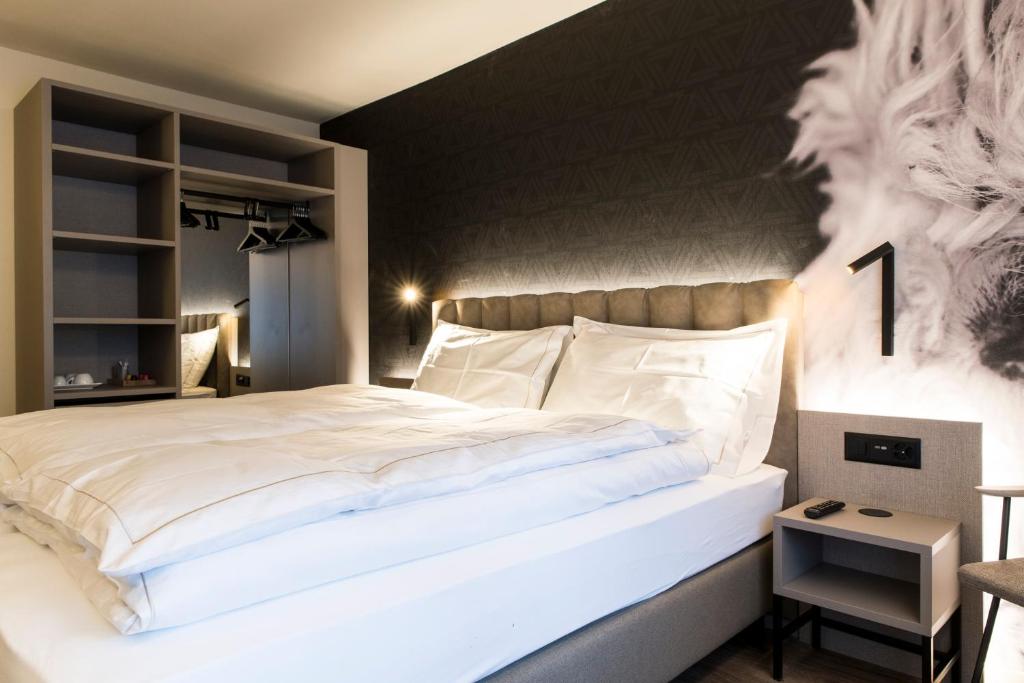 Postel nebo postele na pokoji v ubytování Adaastra Boutique Hotel