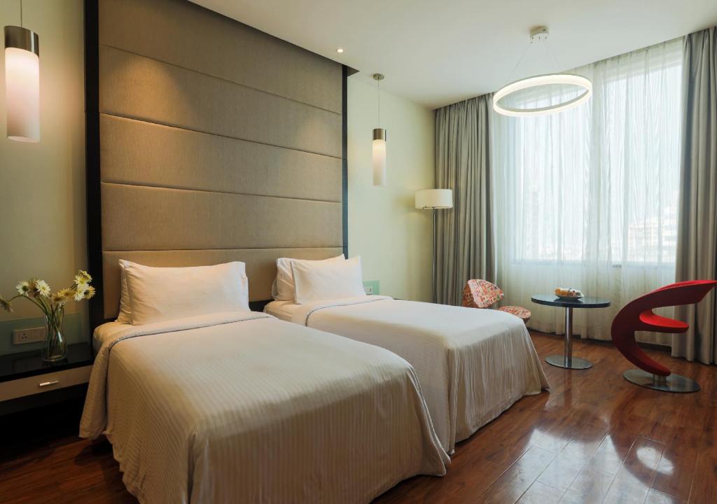 Postel nebo postele na pokoji v ubytování E Hotel