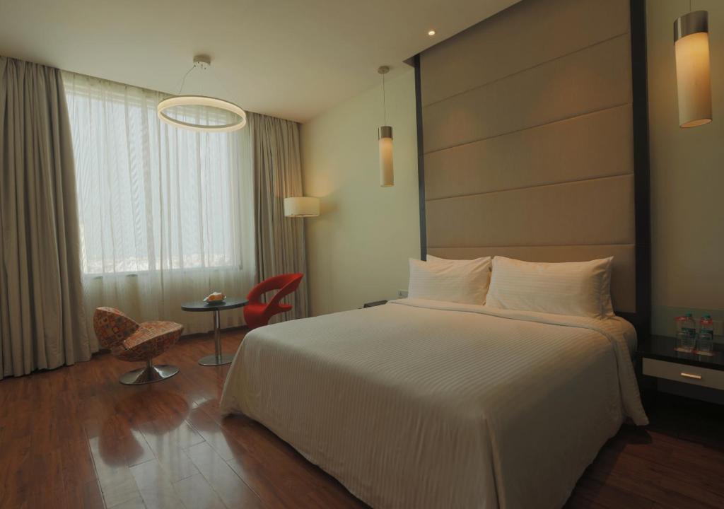 Postel nebo postele na pokoji v ubytování E Hotel