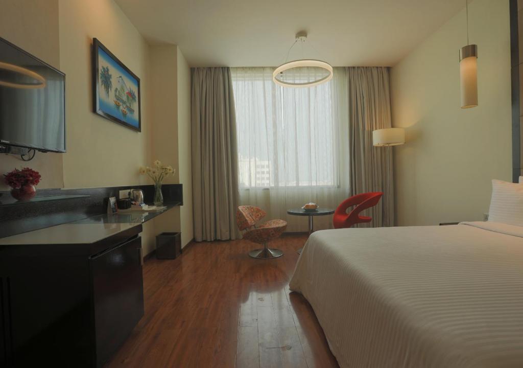 Postel nebo postele na pokoji v ubytování E Hotel