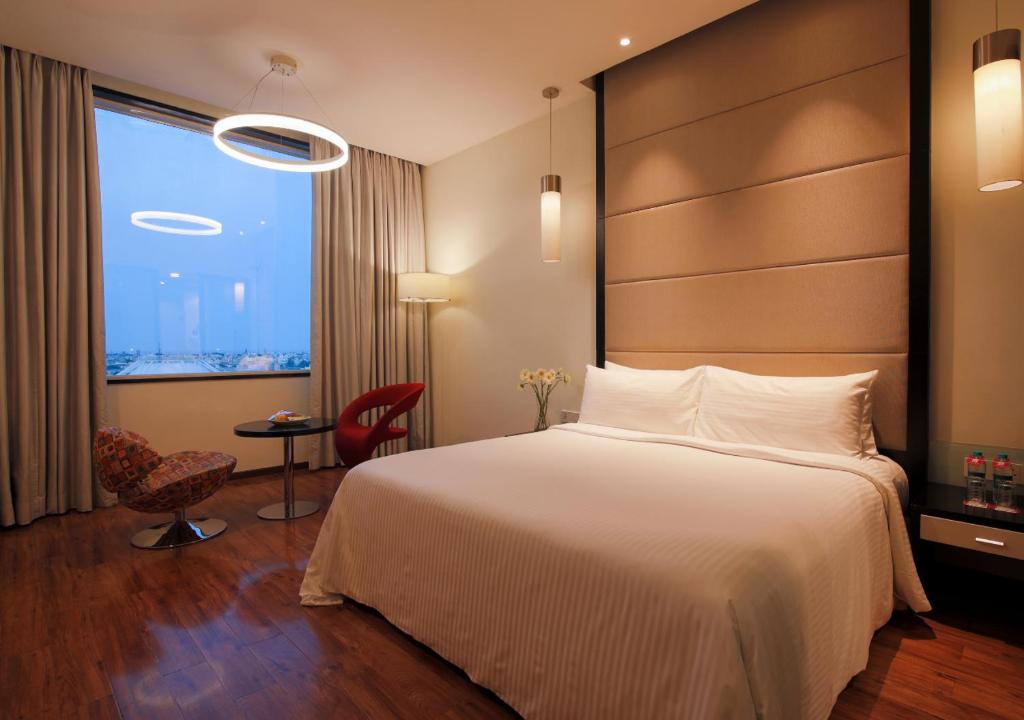 Postel nebo postele na pokoji v ubytování E Hotel