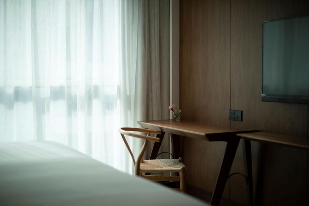 Postel nebo postele na pokoji v ubytování The LUMA Hotel, a Member of Design Hotels