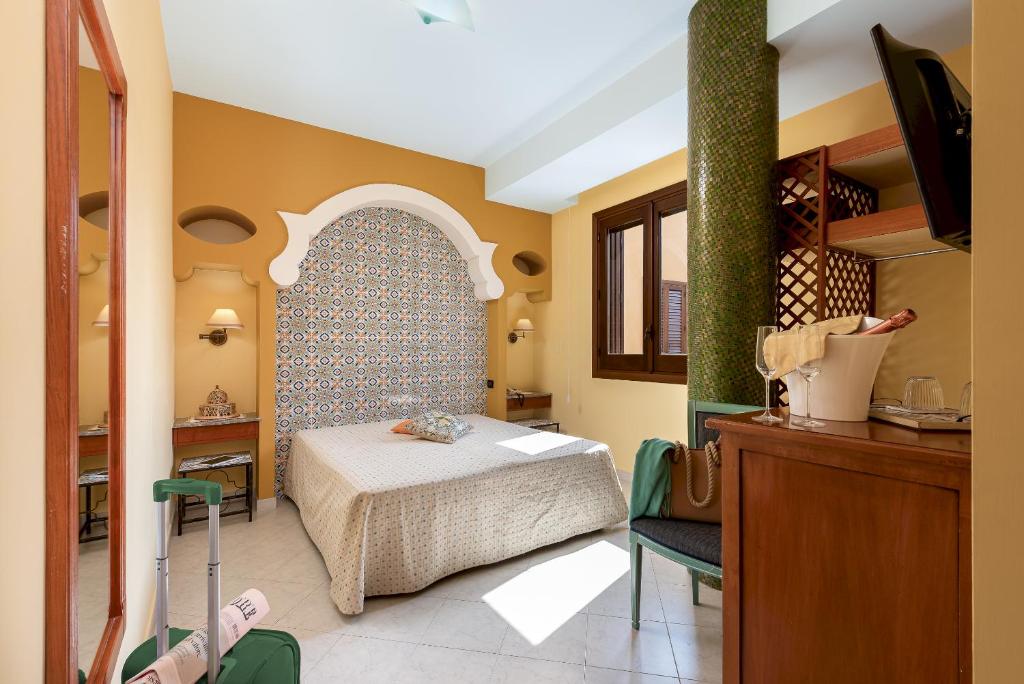 Posteľ alebo postele v izbe v ubytovaní Hotel Sicilya