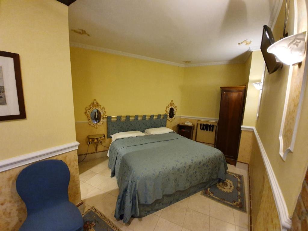 Postel nebo postele na pokoji v ubytování Casa Alla Fenice