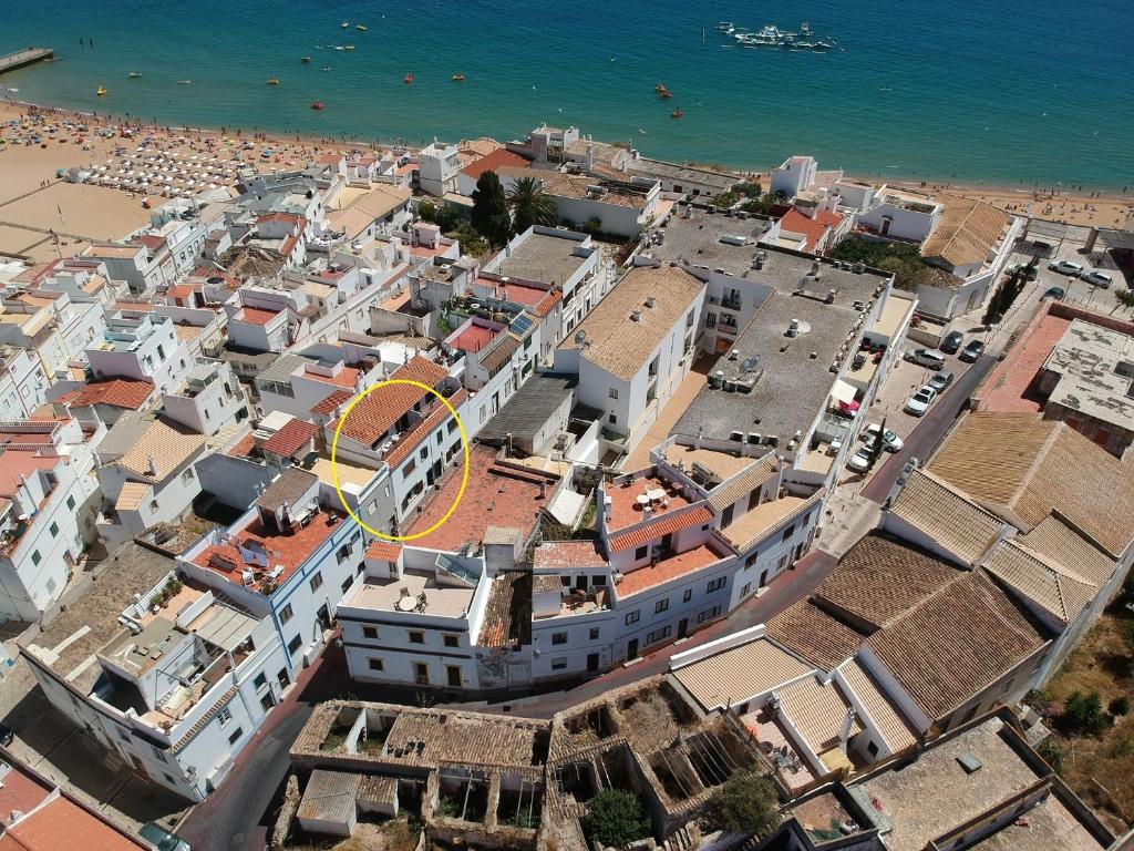 an aerial view of a city with a beach at "Toca do Coelho" Charming Retreat close to Albufeira Beaches in Albufeira