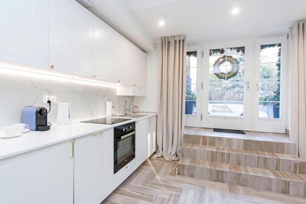 Kuchyňa alebo kuchynka v ubytovaní Apartamenty na Uphagena