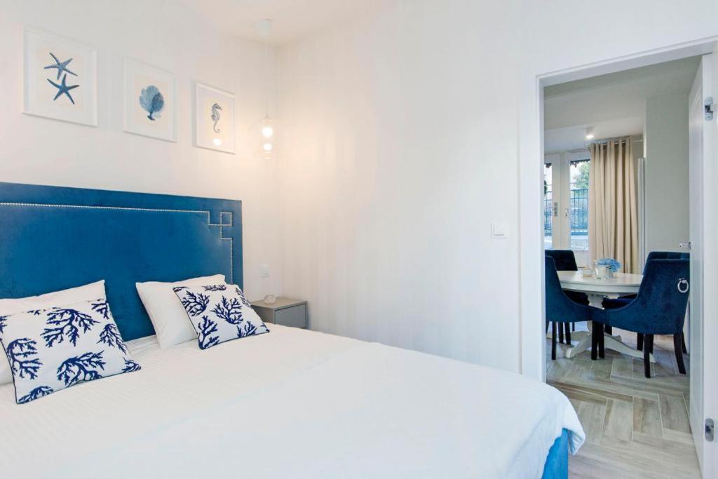 Posteľ alebo postele v izbe v ubytovaní Apartamenty na Uphagena