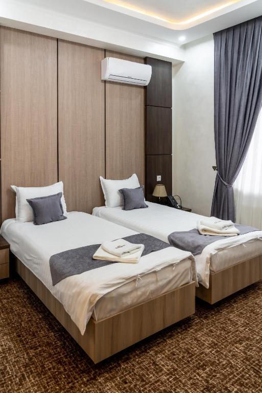 Rayyan Hotel & SPA Tashkent - Deluxe Tweepersoonskamer Met 2 Aparte Bedden