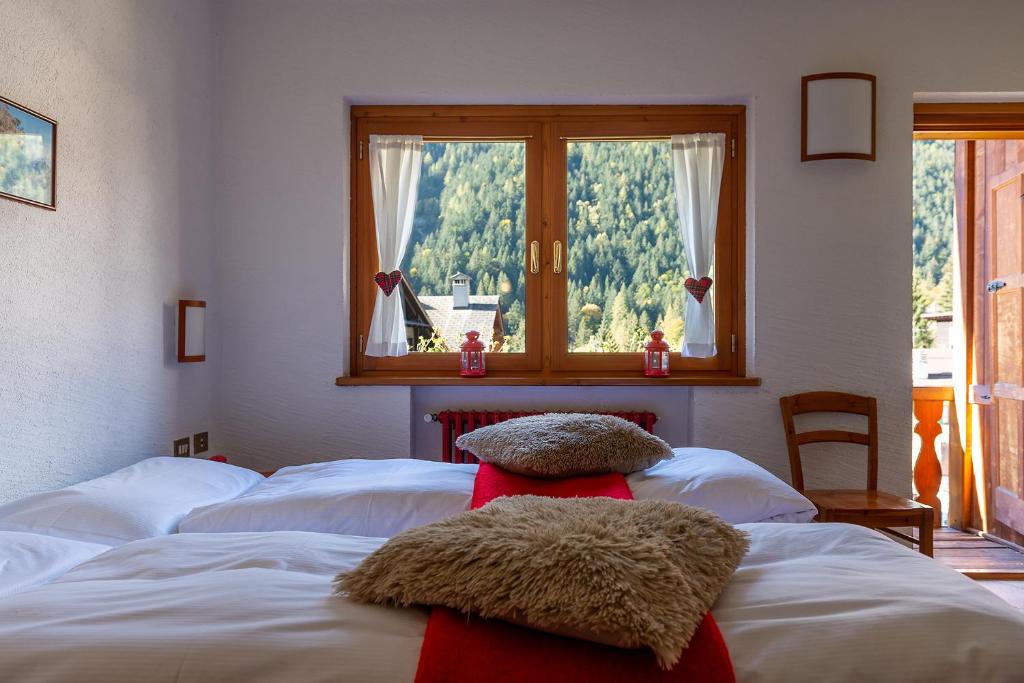 Postel nebo postele na pokoji v ubytování Residence Monterosa