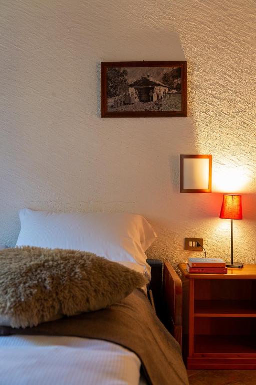 Postel nebo postele na pokoji v ubytování Residence Monterosa