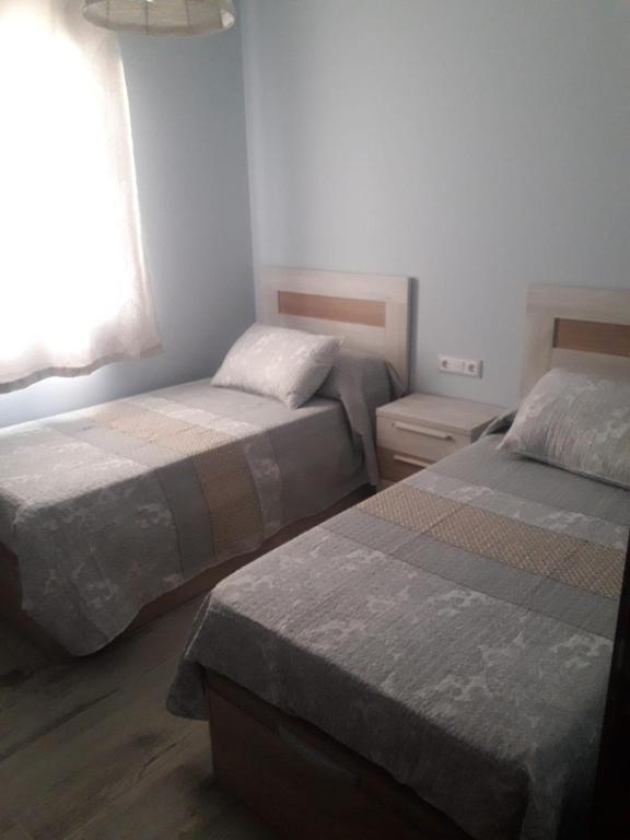 Postel nebo postele na pokoji v ubytování CAL BAR