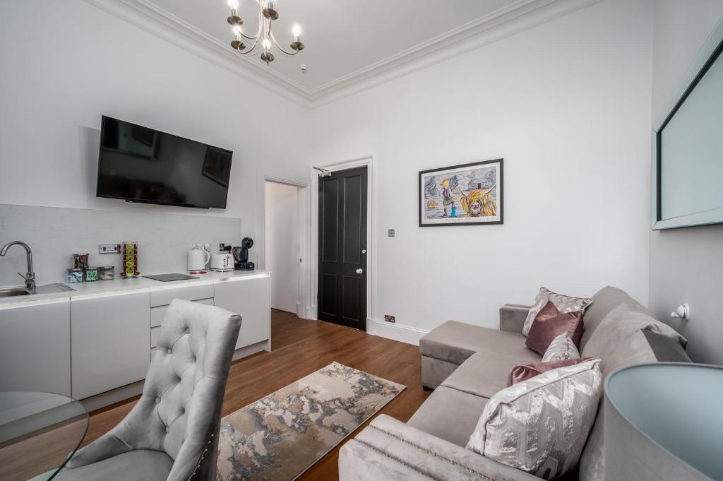 TV a/nebo společenská místnost v ubytování Casa Fresa - Orchar Suites