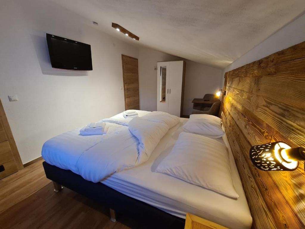 Postel nebo postele na pokoji v ubytování Hotel Pension Annerlhof