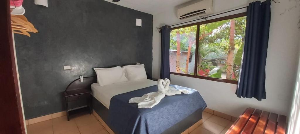 Massai Apartments tesisinde bir odada yatak veya yataklar