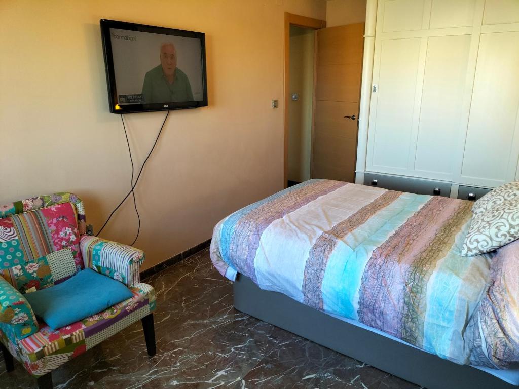 Postel nebo postele na pokoji v ubytování Piso turístico en Granada. Zona Palacio Deportes