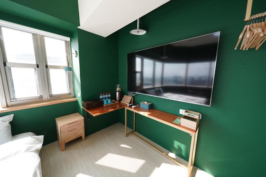 TV a/nebo společenská místnost v ubytování 安蘭居旅店 An Lan Jie Hotel