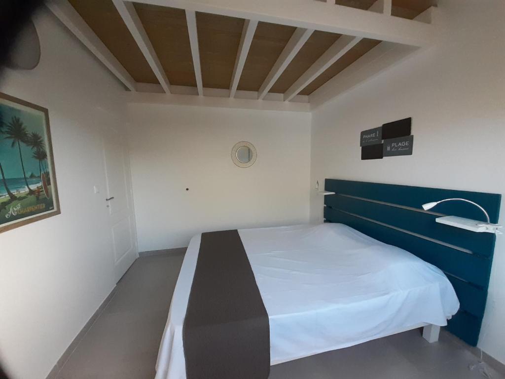 Postel nebo postele na pokoji v ubytování Appartement neuf a 150 metres de la mer wifi