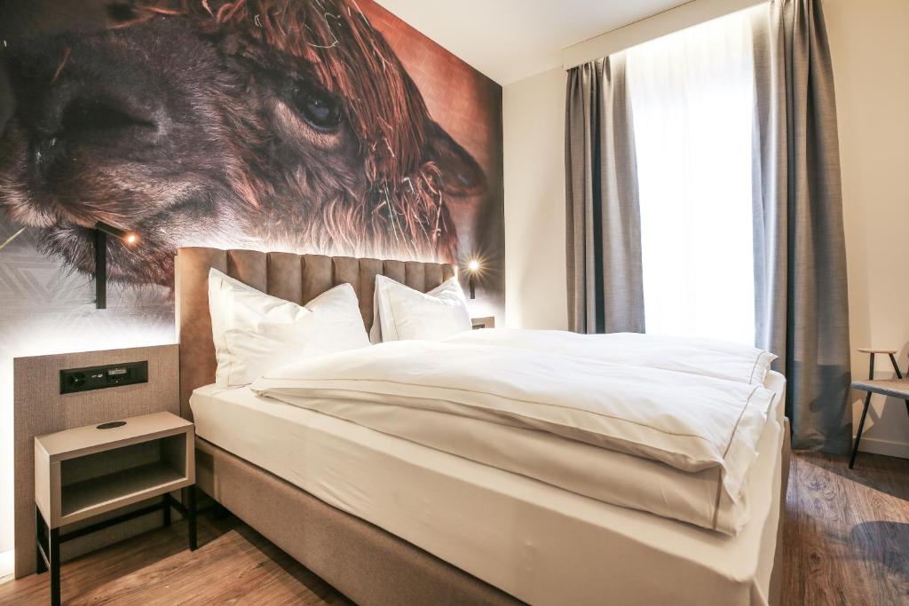 Postel nebo postele na pokoji v ubytování Adaastra Boutique Hotel
