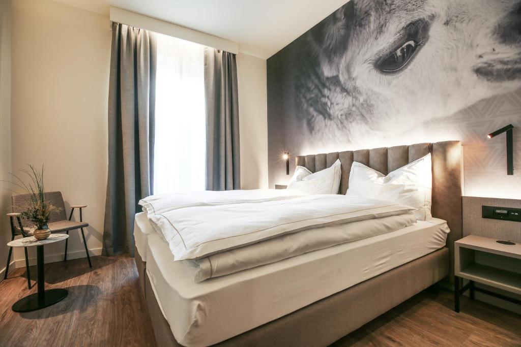 Postel nebo postele na pokoji v ubytování Adaastra Boutique Hotel