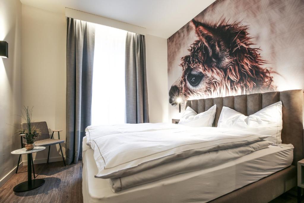 Postel nebo postele na pokoji v ubytování Adaastra Boutique Hotel