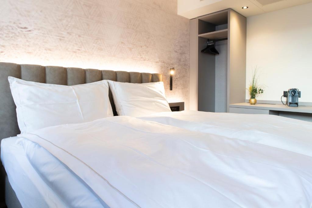 Postel nebo postele na pokoji v ubytování Adaastra Boutique Hotel