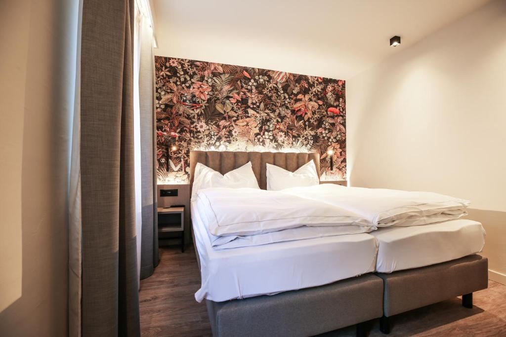 Postel nebo postele na pokoji v ubytování Adaastra Boutique Hotel