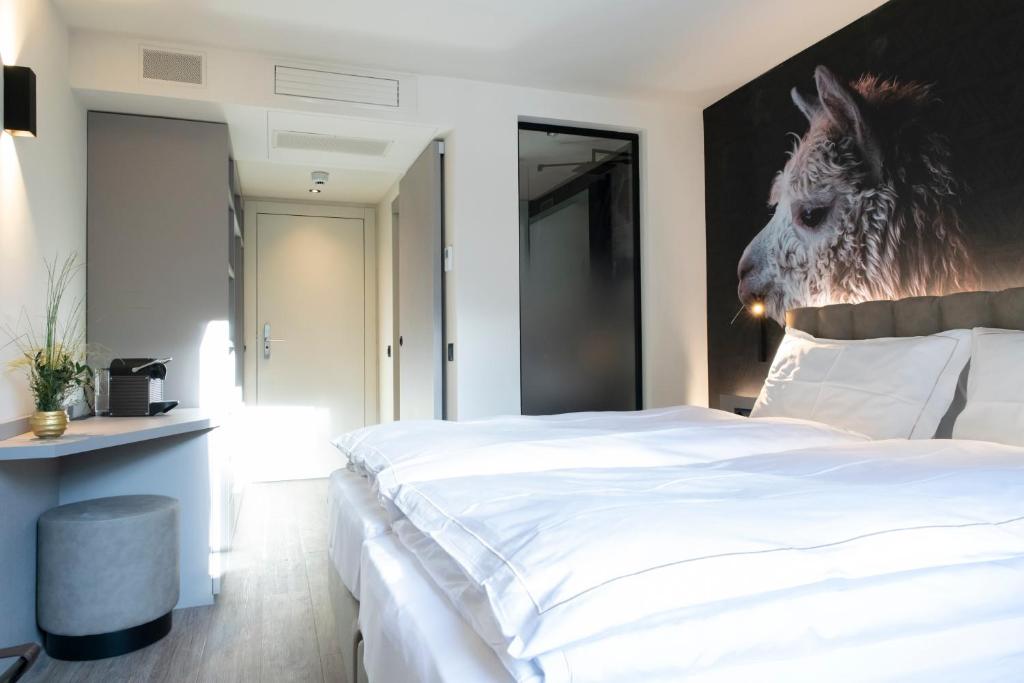Postel nebo postele na pokoji v ubytování Adaastra Boutique Hotel