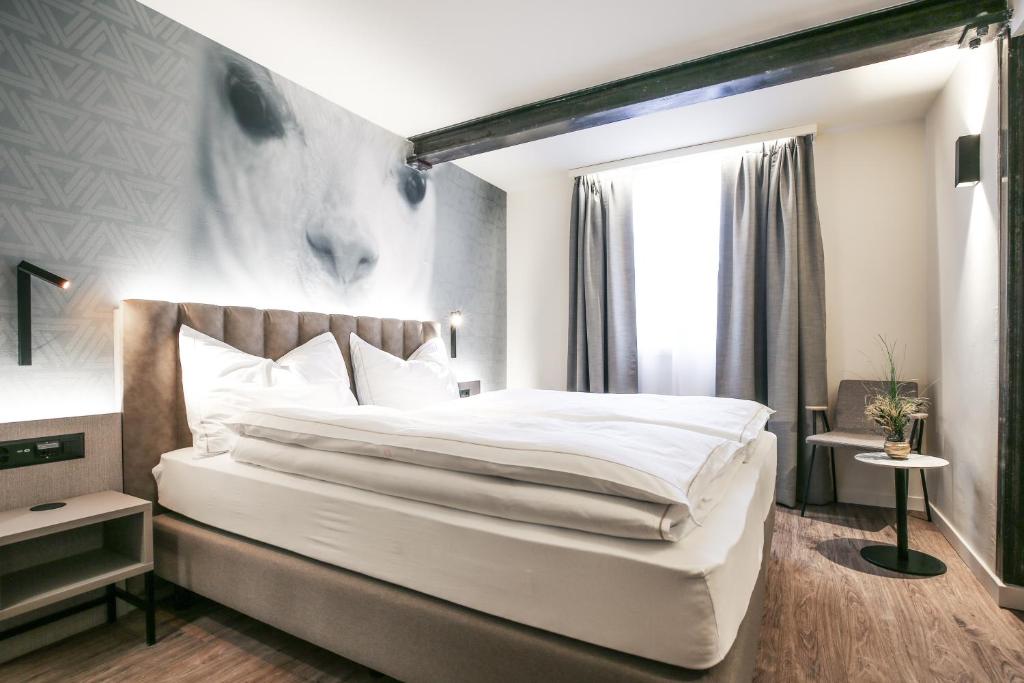 Postel nebo postele na pokoji v ubytování Adaastra Boutique Hotel