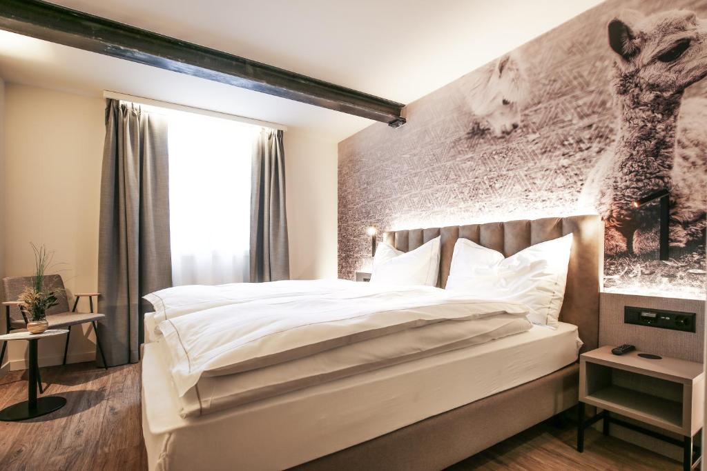 Postel nebo postele na pokoji v ubytování Adaastra Boutique Hotel