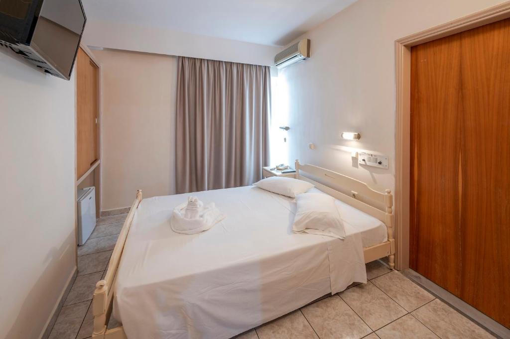 Postel nebo postele na pokoji v ubytování Hotel Koala