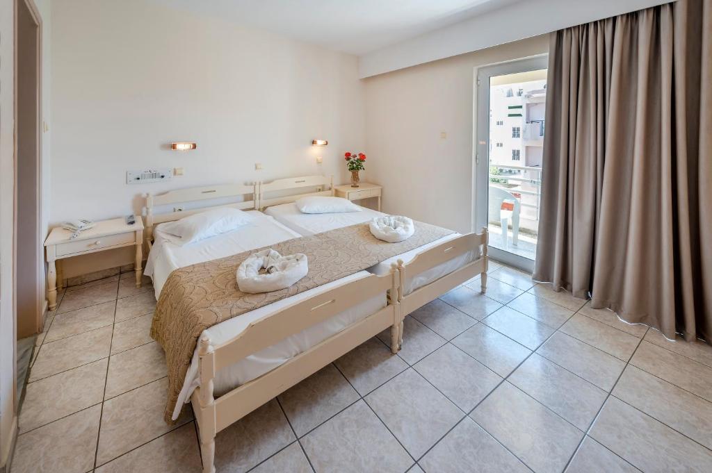 Postel nebo postele na pokoji v ubytování Hotel Koala