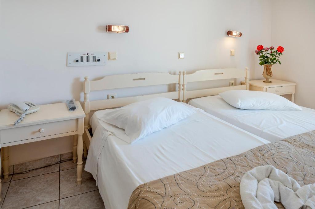 Postel nebo postele na pokoji v ubytování Hotel Koala