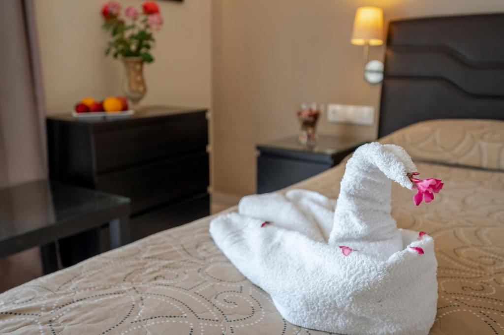 Postel nebo postele na pokoji v ubytování Hotel Koala