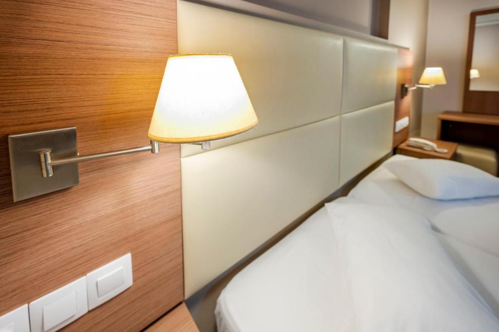 Postel nebo postele na pokoji v ubytování Hotel Koala