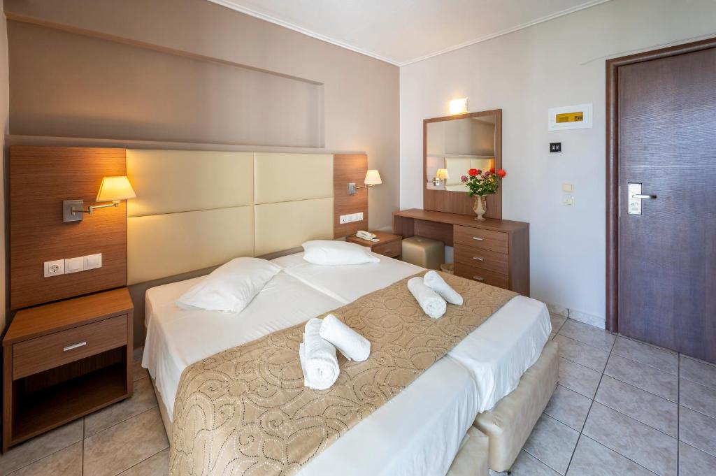 Postel nebo postele na pokoji v ubytování Hotel Koala