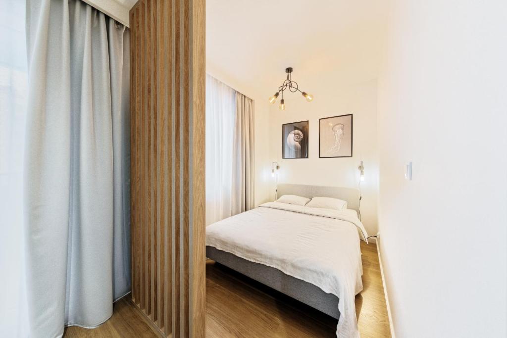 Posteľ alebo postele v izbe v ubytovaní Studio Angielska Grobla