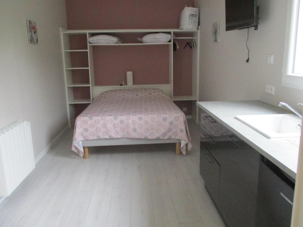 Postel nebo postele na pokoji v ubytování Le Pijolin