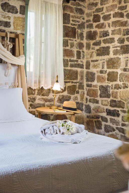 Postel nebo postele na pokoji v ubytování Palaeopoli Villas