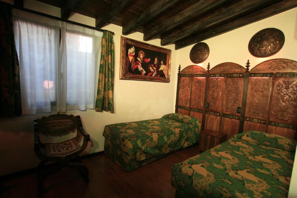 Postel nebo postele na pokoji v ubytování Castello Di Pavone