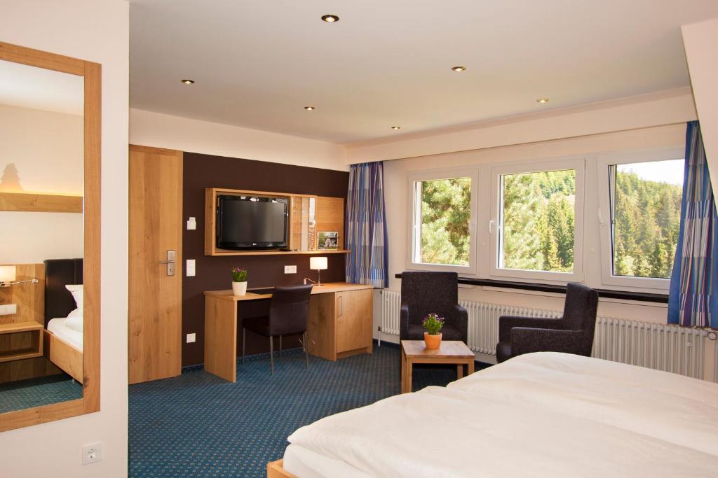 Postel nebo postele na pokoji v ubytování Hotel Gut Vorwald