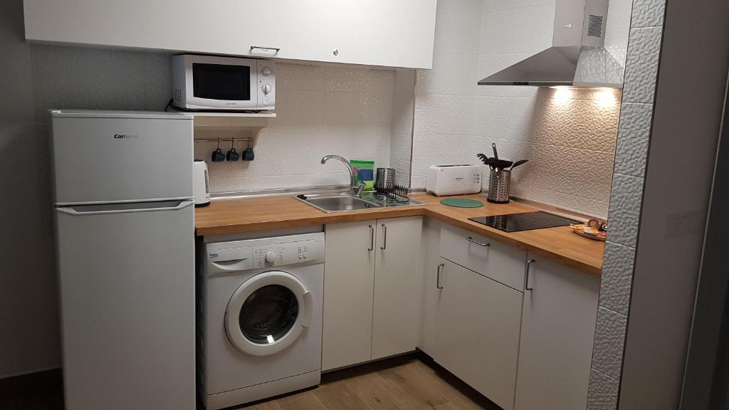 Kuchyňa alebo kuchynka v ubytovaní mi apartamento 60