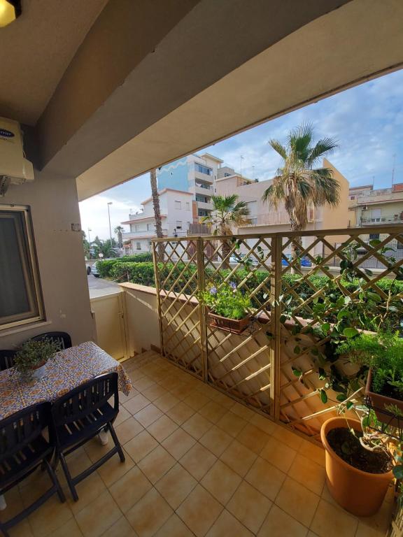 a balcony with a view of a palm tree at Rifugio del marinaio in Milazzo