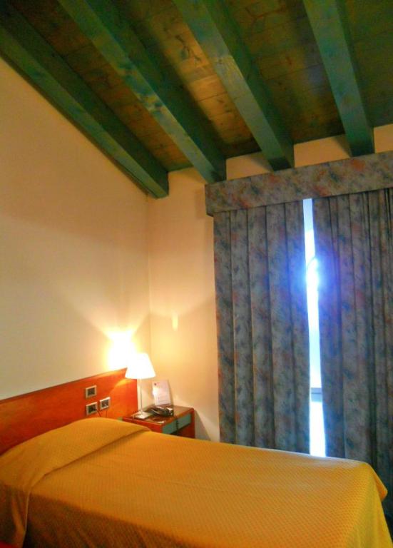 Postel nebo postele na pokoji v ubytování Hotel Filanda